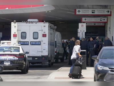 Police: Woman opened fire in Dallas airport; cop shot her